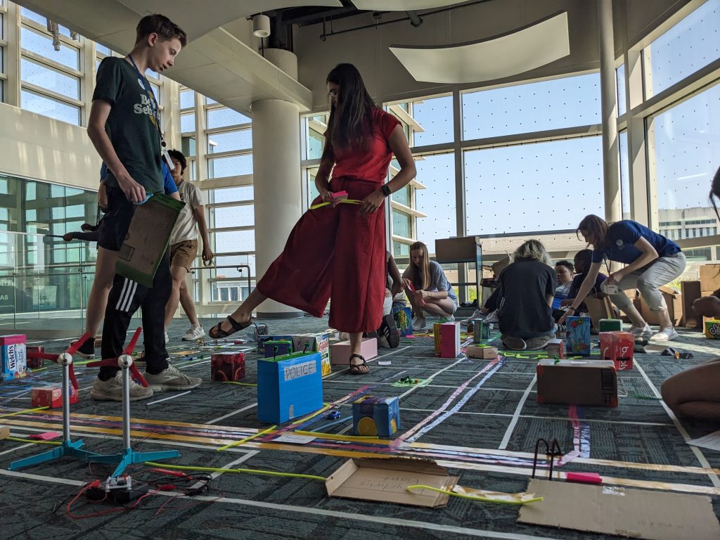 Youth in the Teen Climate Ambassador program create a model climate resilient city using cardboard.