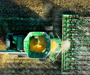 Farming tractor harvesting crops to show synthetic biology at work