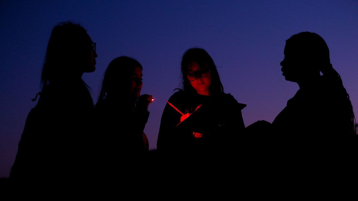 UNC students collecting data on artificial light at night.