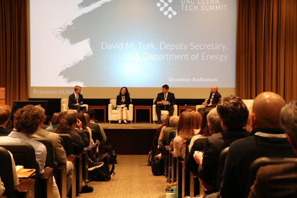 UNC students (l to r) Jackson Lefler, Victoria Farella and Anthony Buckley have a fireside chat with U.S. Department of Energy Deputy Secretary David Turk.