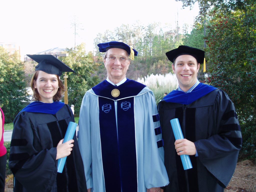 Andrews with graduating doctoral students Caryn Bredenkamp and Andrew Huston. Photo courtesy Pete Andrews.