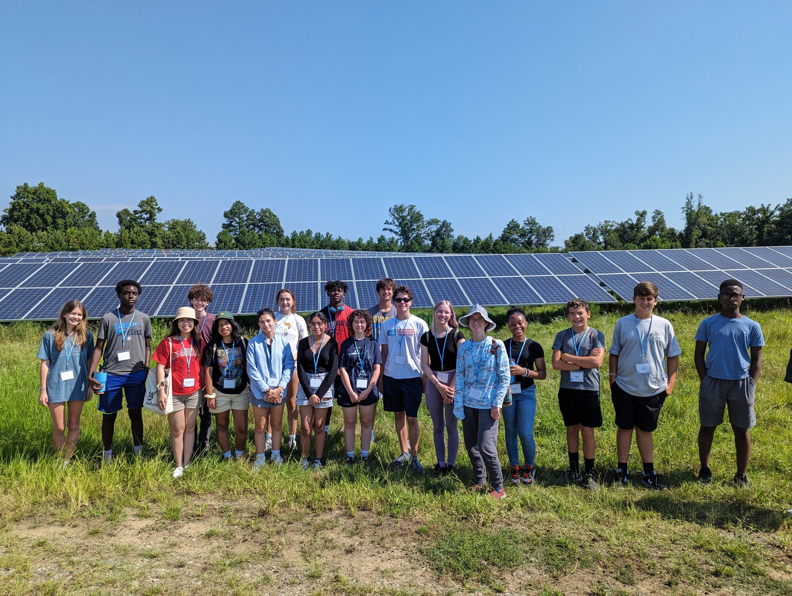 Students in front of solar panels.